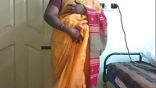 desi  indian horny tamil telugu kannada malayalam hindi cheating wife vanitha crippling orange colour saree  showing big boobs and shaved pussy discombobulate hard boobs discombobulate nip rubbing pussy masturbation